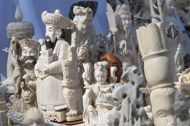 Ivory sculptures are on display before being crushed Thursday in New York's Central Park. Nearly 2 tons of ivory was destroyed to protest slaughter of elephants.