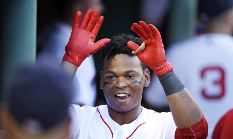 Rafael Devers celebrates his two-run home run off Chicago White Sox starting pitcher Miguel Gonzalez in the first inning Thursday night at Fenway Park.