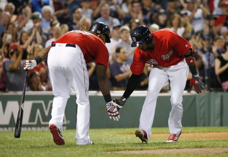 Boston's Eduardo Nunez, right, celebrates his solo home run with Hanley Ramirez in the sixth inning Friday night against the Chicago White Sox at Fenway Park.