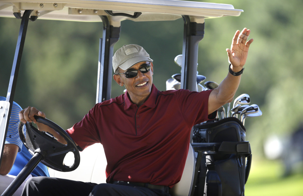 President Obama golfs at Farm Neck Golf Club during a 2015 family vacation on Martha's Vineyard in Massachusetts.