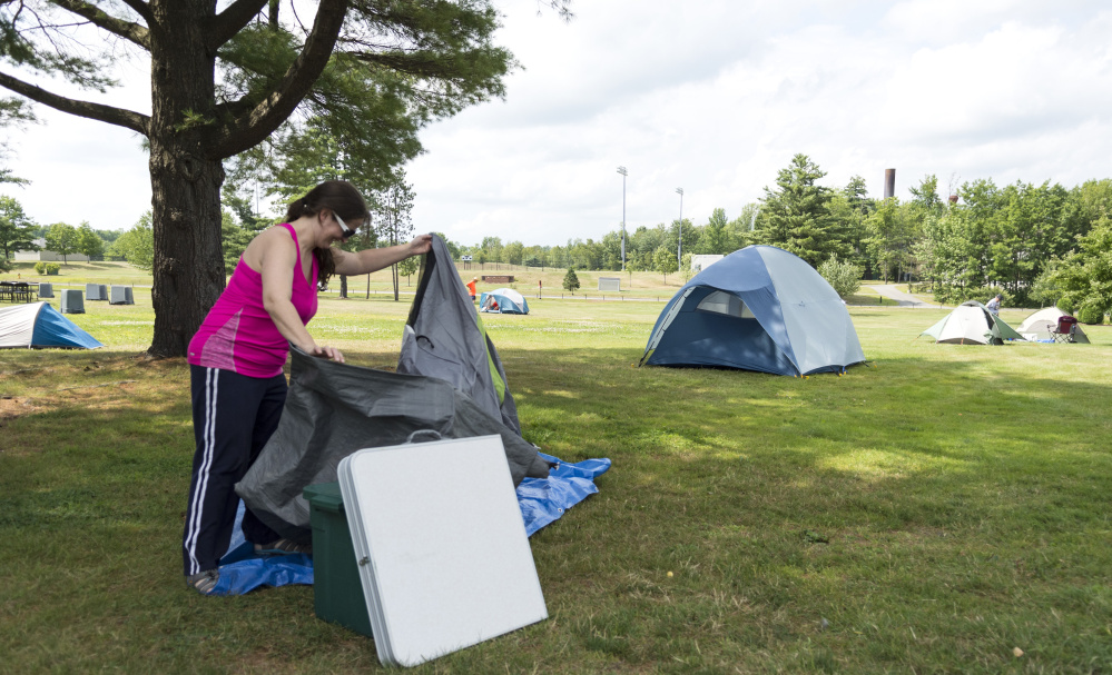 Amanda Jones of Shrewsbury, Pa., sets up a ground cloth Friday where she intends to spend the week camping on the Colby College campus in Waterville during the Appalachian Trail Conservancy Conference.
