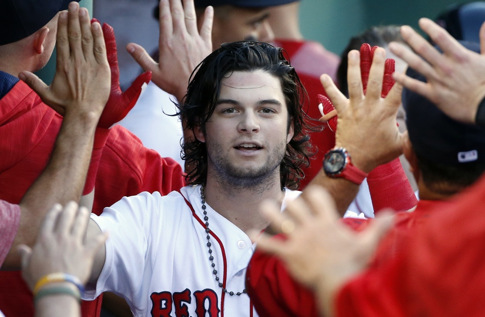 Boston's Andrew Benintendi celebrates his two-run home run during the first inning of Saturday's 4-1 win over the Chicago White Sox in Boston, Saturday, Aug. 5, 2017. (