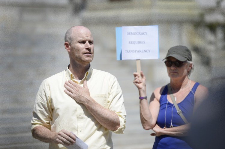 Jack O'Brien, a member of Fair Rent Portland, speaks at a rally Wednesday at City Hall. On Thursday, he said, "We're excited that the city has found a potential solution" to a technical error that could keep two citizens initiatives off the city's November ballot.