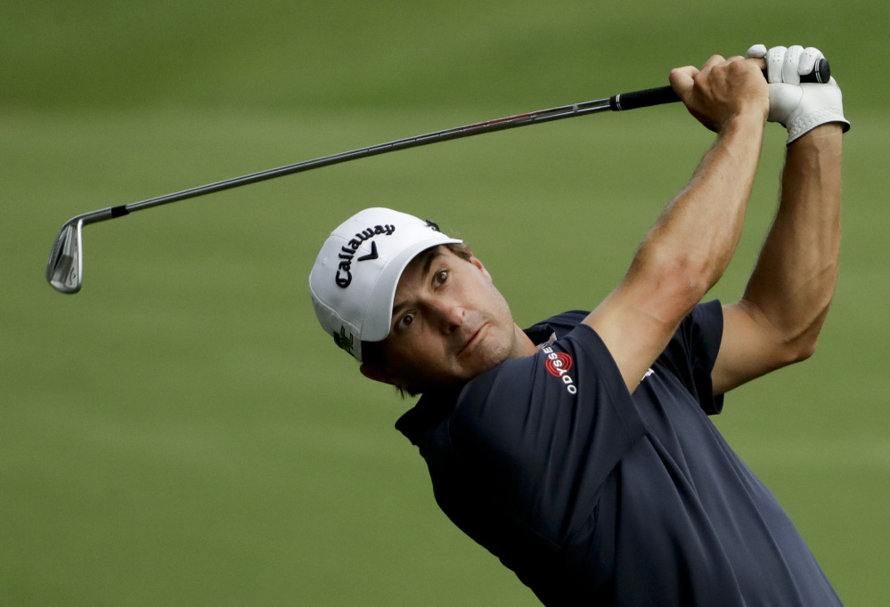 Kevin Kisner sank a birdie putt on No. 18 Thursday to finish the first round of the PGA Championship at 67, tied for the lead with Thorbjorn Olesen at the Quail Hollow Club in Charlotte, N.C.