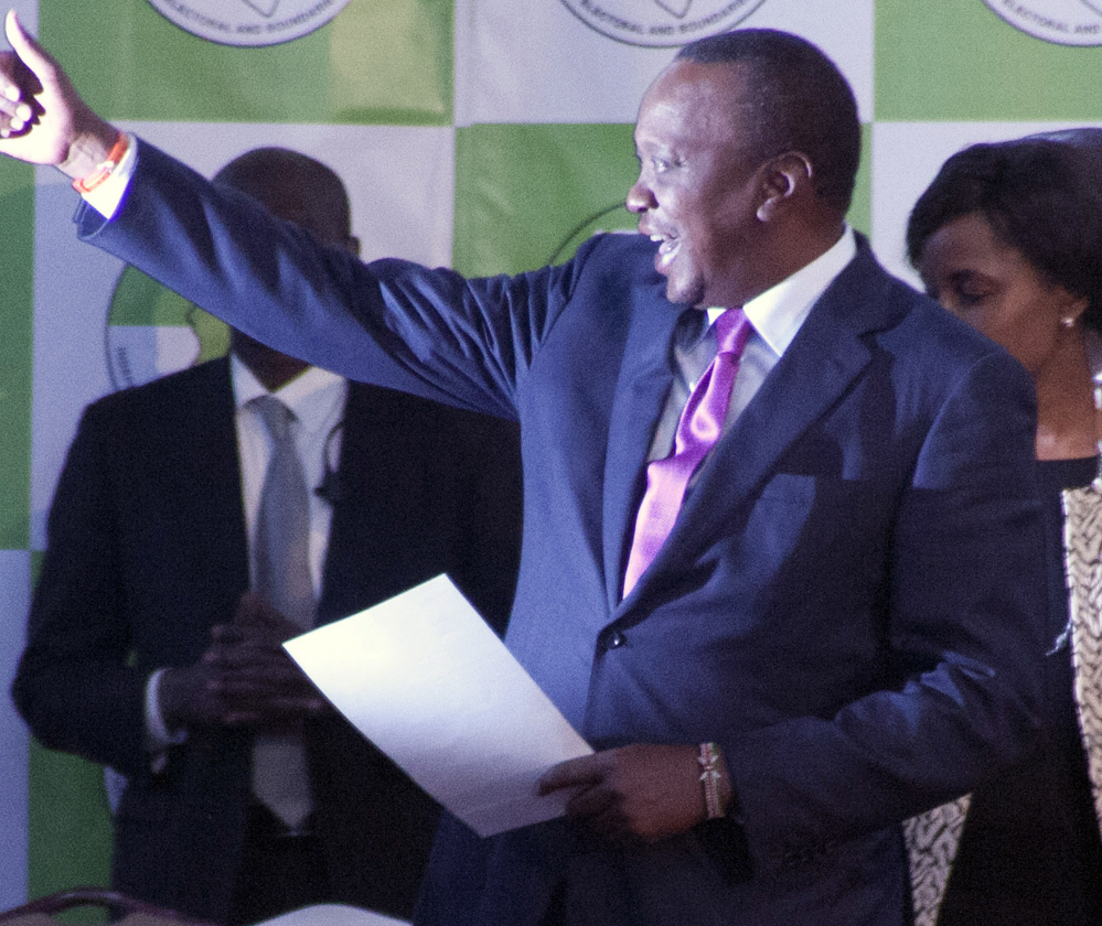 President Uhuru Kenyatta reacts after the announcement of his re-election Friday in Nairobi, Kenya.