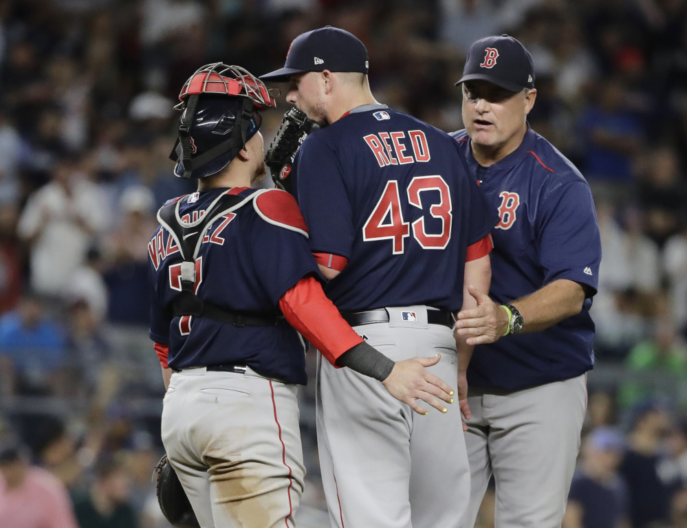 Red Sox manager John Farrell takes relief pitcher Addison Reed out of the game in the eighth inning, which proved disastrous for Boston. Reed failed to get anyone out and a 3-0 lead vanished.