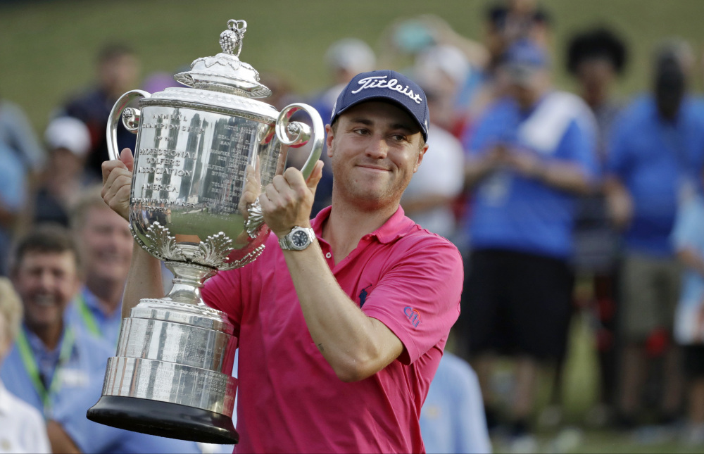 Justin Thomas poses with the Wanamaker Trophy after winning the PGA Championship on Sunday at Quail Hollow Club Sunday in Charlotte, N.C.