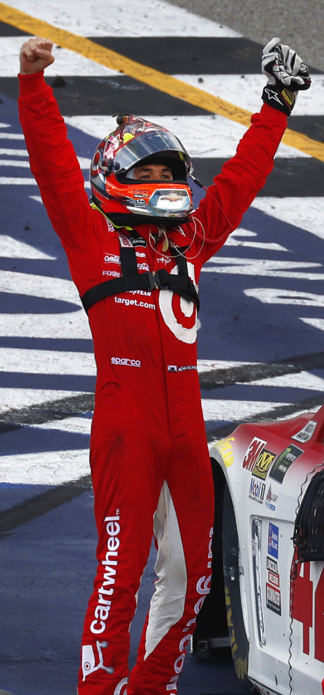 Associated Press/Paul Sancya
Kyle Larson celebrates after he joined Martin Truex Jr. and Jimmie Johnson as the only Cup Series drivers with at least three victories in 2017.