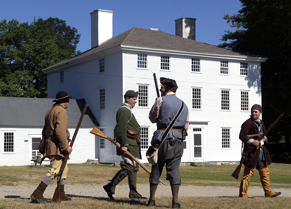 Eighteenth-century scouts gather at the Pownalborough Court House on Sunday in Dresden. Re-enactors played militiamen patrolling for natives during the French and Indian War.