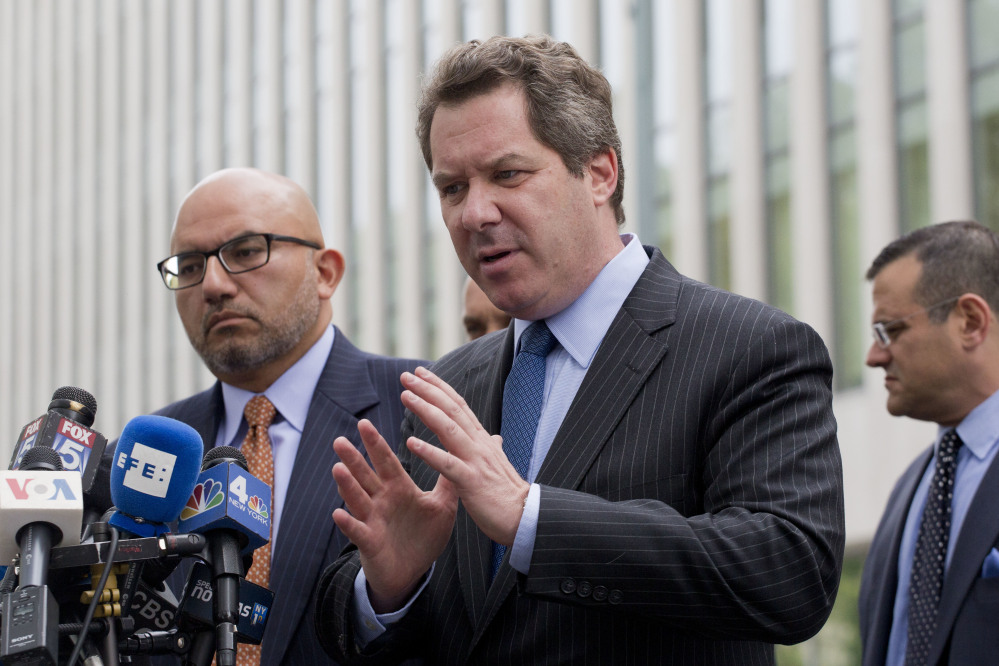 Attorney Jeffrey Lichtman, center, speaks at a news conference outside Brooklyn Federal Court on Monday in New York following a hearing for Joaquin "El Chapo" Guzman. Lichtman is part of a legal team that hopes to represent Guzman.