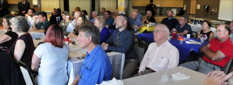 Members of the Waterville Rotary club listen to guest speaker Gov. Paul LePage during a luncheon on Monday.