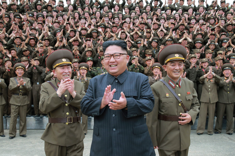 Kim Jong Un acknowledges a welcome from the military officers during his visit to Korean People's Army's Strategic Forces in North Korea. Kim said he will give the order for a missile test near Guam if the United States continues its "extremely dangerous actions" on the Korean Peninsula.