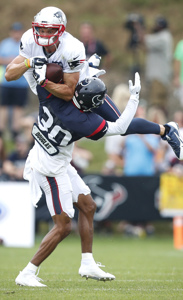 This weekend, they may do it in a game, but on Tuesday it was practice as Chris Hogan of the Patriots was upended by Kevin Johnson of the Texans.