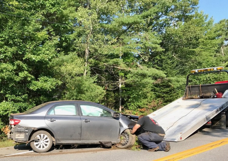 This Toyota Corolla was destroyed Wednesday when it spun off Route 137 and crashed among trees. Police are stepping up patrols on the road to try to avert such accidents.