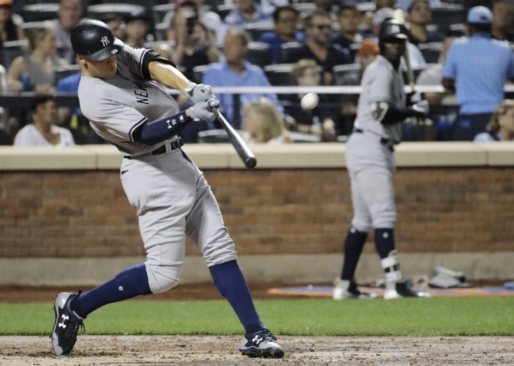 Aaron Judge of the Yankees homers during the fourth inning of Wednesday's game against the New York Mets. Didi Gregorius also homered as the Yankees won, 5-3.