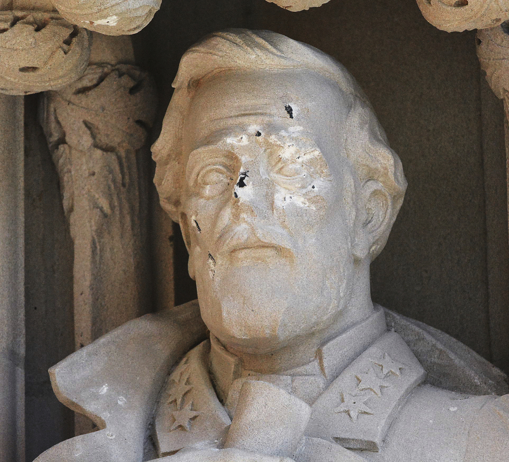 The defaced Gen. Robert E. Lee statue stands at the Duke Chapel in Durham, N.C. Duke President Vincent E. Price said he was discussing how to deal with reactions to the statue.