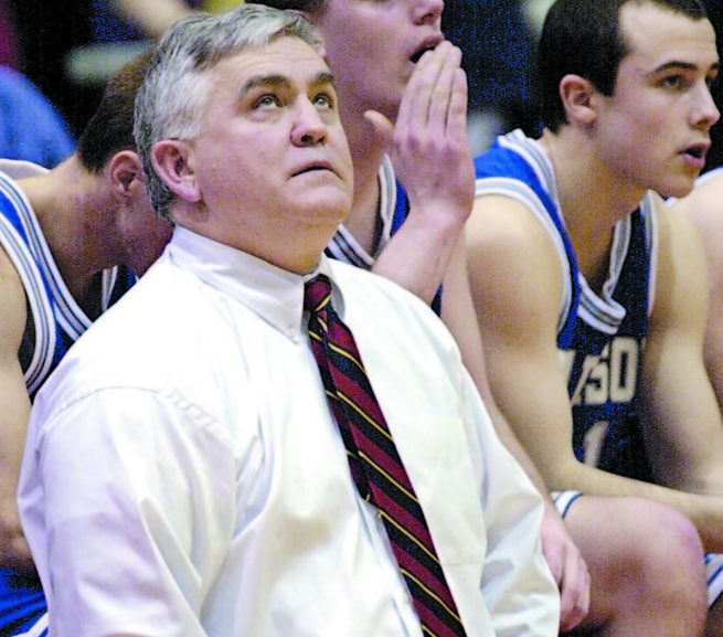 Tom Maines watches the clock tick down during a 2001 game when he was the boys' basketball coach at Madison High. Maines, who will be inducted into the Maine Basketball Hall of Fame on Sunday, achieved his greatest success at Morse High, winning three straight Class A championships.