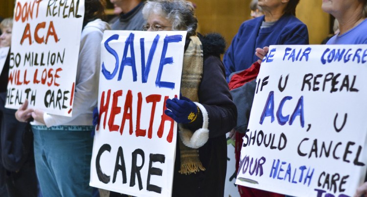 People attend a health care rally at the Indiana Statehouse in support of the Affordable Care Act on Jan. 15. Having failed to repeal the law, the Trump administration is attempting to undermine it.
