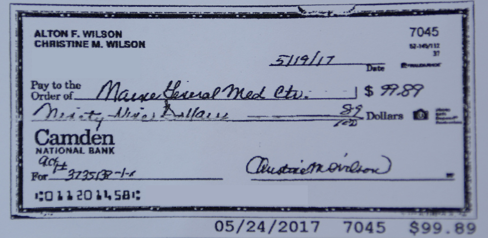 A copy of a check sent to MaineGeneral Medical Center that has been edited to block out identifying information is shown in this photo taken on Wednesday.