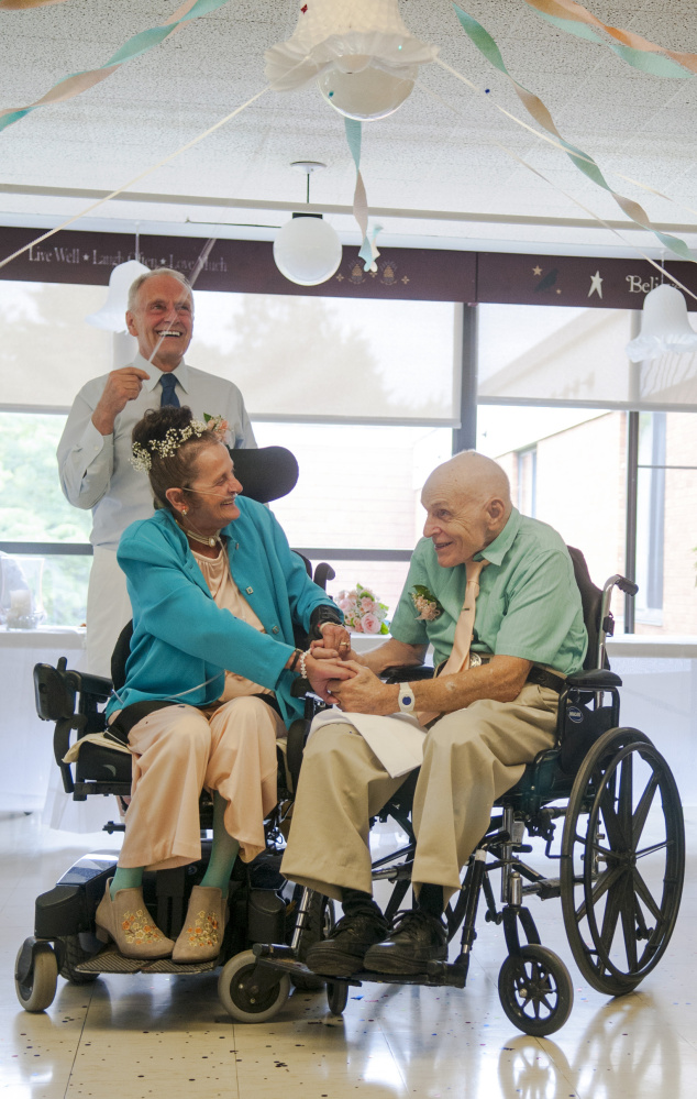 The bride's brother, Don Trott, shakes confetti Saturday upon Sonya Trott and Bryant Brunye, who made history as the first Gray Birch residents to marry. "It's the happiest day of my life," the 75-year-old bride said.