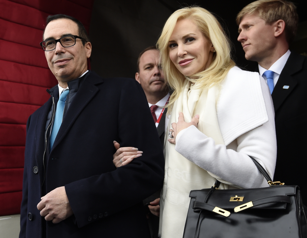 Then Treasury Secretary-designate Stephen Mnuchin and his then-fiancee, Louise Linton, are shown in Washington in January. Linton offered a condescending response to a social media critic Monday, telling a mother of three that that she was "adorably out of touch." Mnuchin and Linton were married in June.