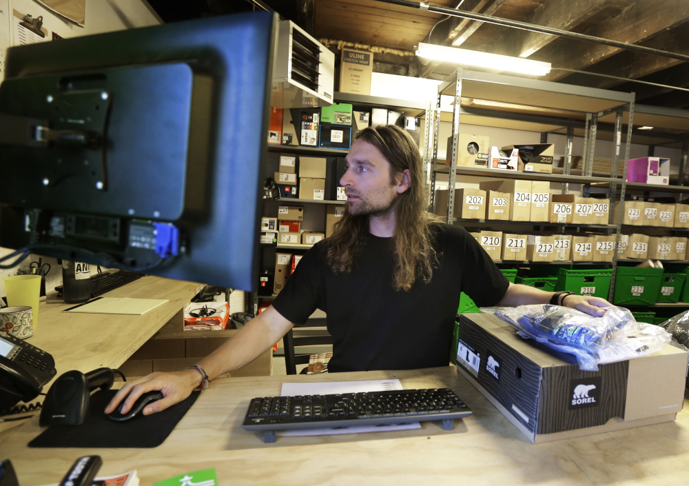 Martin Goldman processes returned items at evo, a Seattle-based sporting goods retailer, which also lets customers pick up orders at competitors' stores.