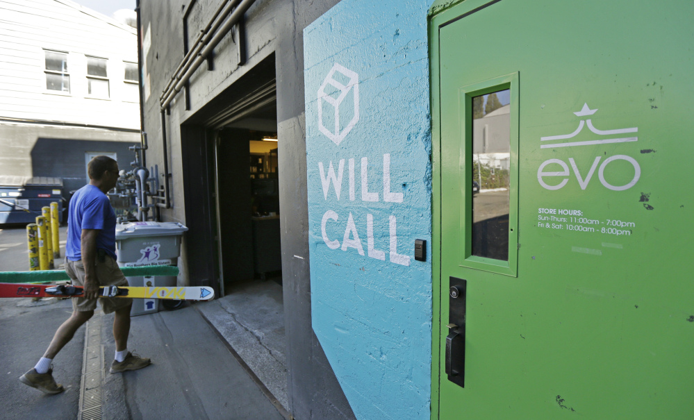 A man walks into the will-call department of evo in Seattle last month. The independent retailer also offers services like travel planning for customers who want to go on snowboarding, surfing or other outdoor sports-focused vacations.