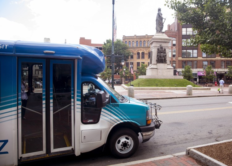 The Metro Breez bus stops in Monument Square in June. The Greater Portland Transit Service has dropped the Breez’s Falmouth loop and added a Portland-Brunswick route that stops in Yarmouth and Freeport.