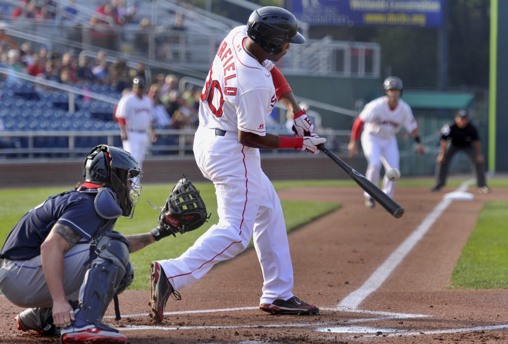 Jeremy Barfield of the Sea Dogs connects for an RBI single that drove in Chad De La Guerra from third base in Game 1 of a doubleheader Friday night against the Binghamton Rumble Ponies. The Sea Dogs won the opener but lost Game 2.