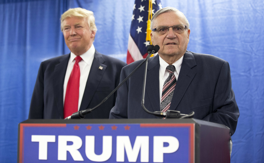 In this Jan. 26, 2016, file photo, Republican presidential candidate Donald Trump is joined by Maricopa County, Ariz., Sheriff Joe Arpaio during a new conference in Marshalltown, Iowa. 