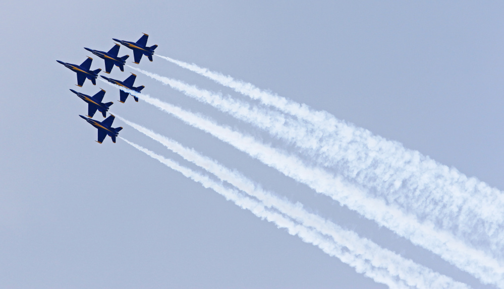 The U.S. Navy Blue Angels stay in steady formation at the Great State of Maine Air Show at Brunswick Executive Airport. The event continues Sunday.