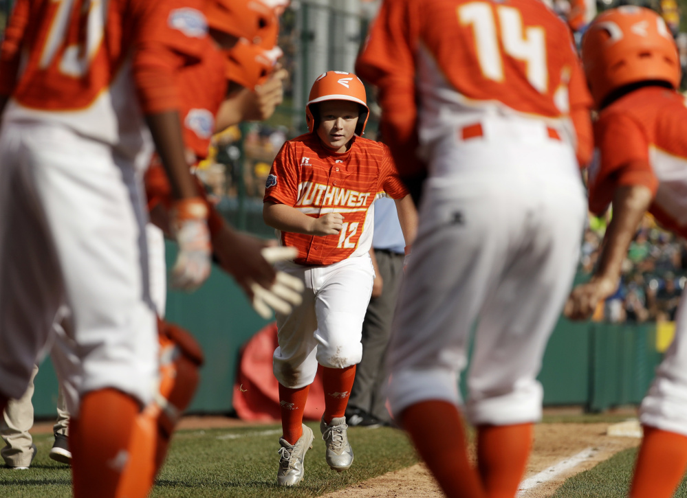 Clayton Wigley rounds the bases after hitting a home run for Lufkin, Texas, in the U.S. championship game Saturday at the Little League World Series in South Williamsport, Pa. Lufkin won, 6-5.