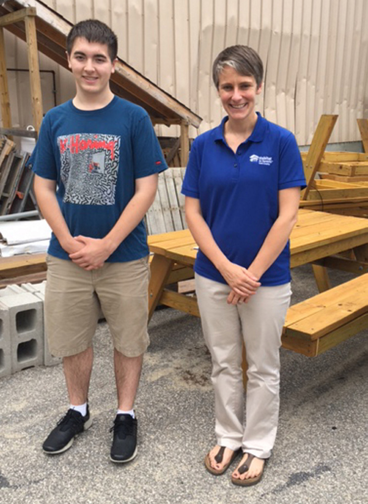 Cole Cerabona of West Kennebunk earned Eagle Scout status for successfully building picnic tables, pictured, for Habitat for Humanity York County. Habitat executive director Amy Nucci is at right.