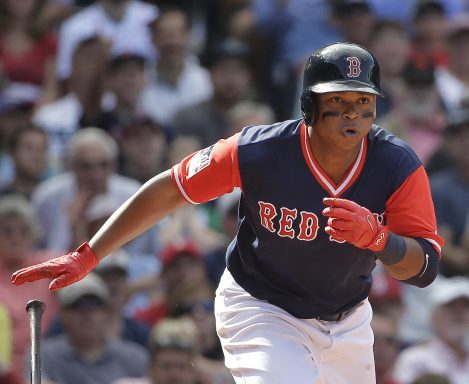 Red Sox's Rafael Devers runs after hitting an RBI double off a pitch by Baltimore Orioles' Mychal Givens as Orioles' Welington Castillo looks on in the sixth inning Sunday in Boston.