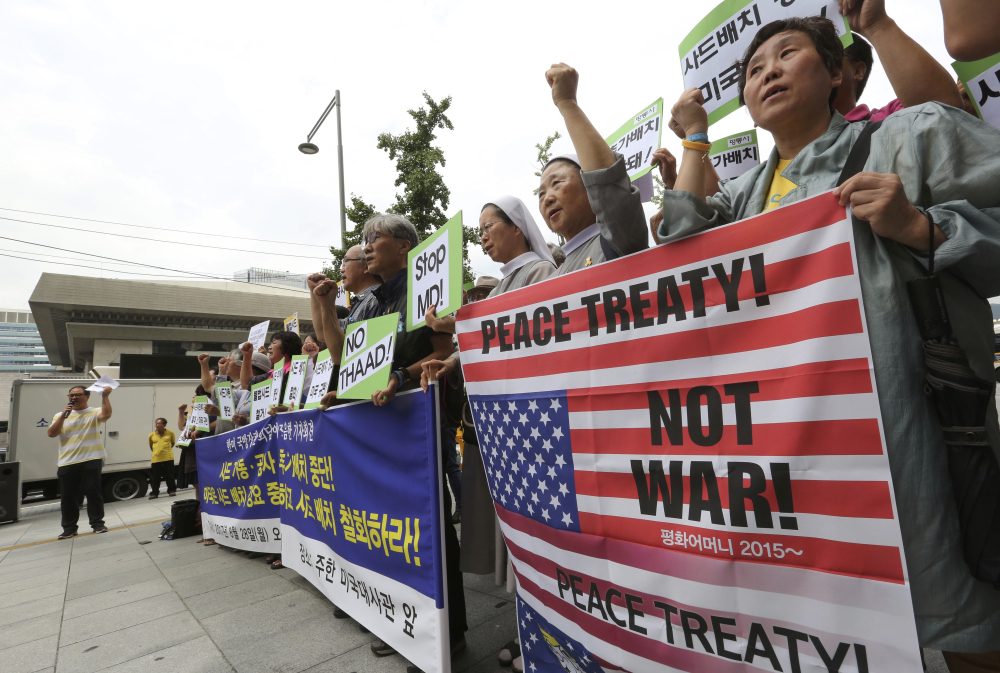 South Korean protesters stage a rally against the deployment of an advanced U.S. missile defense system called Terminal High-Altitude Area Defense, or THAAD, near the U.S. embassy in Seoul, South Korea, on Monday. North Korea fired several rockets into the sea Saturday in the continuation of its rapid nuclear and missile expansion, prompting South Korea to press ahead with military drills involving U.S. troops that have angered Pyongyang.