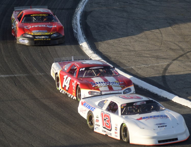 Cassius Clark, right, leads the pack during the Oxford 250 on Sunday at Oxford Plains Speedway.