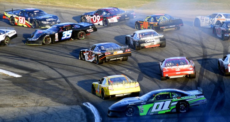 Cars get spun out after a multi-car crash during the Oxford 250 on Sunday at Oxford Plains Speedway.