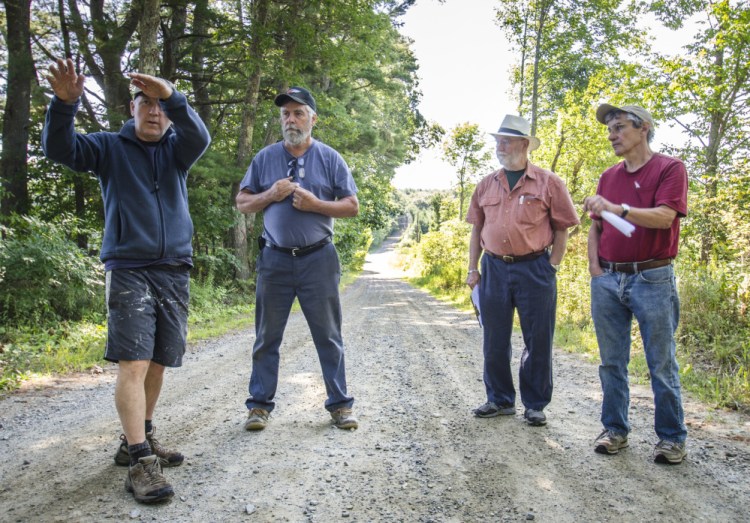 Whitefield town officials and residents gather Monday on Hollywood Boulevard to discuss the removal of trees to enhance road safety and improve drainage. From left are: Chris Hamilton, who lives on the road, Road Commissioner David Boynton and Selectmen Frank Ober and Tony Marple.