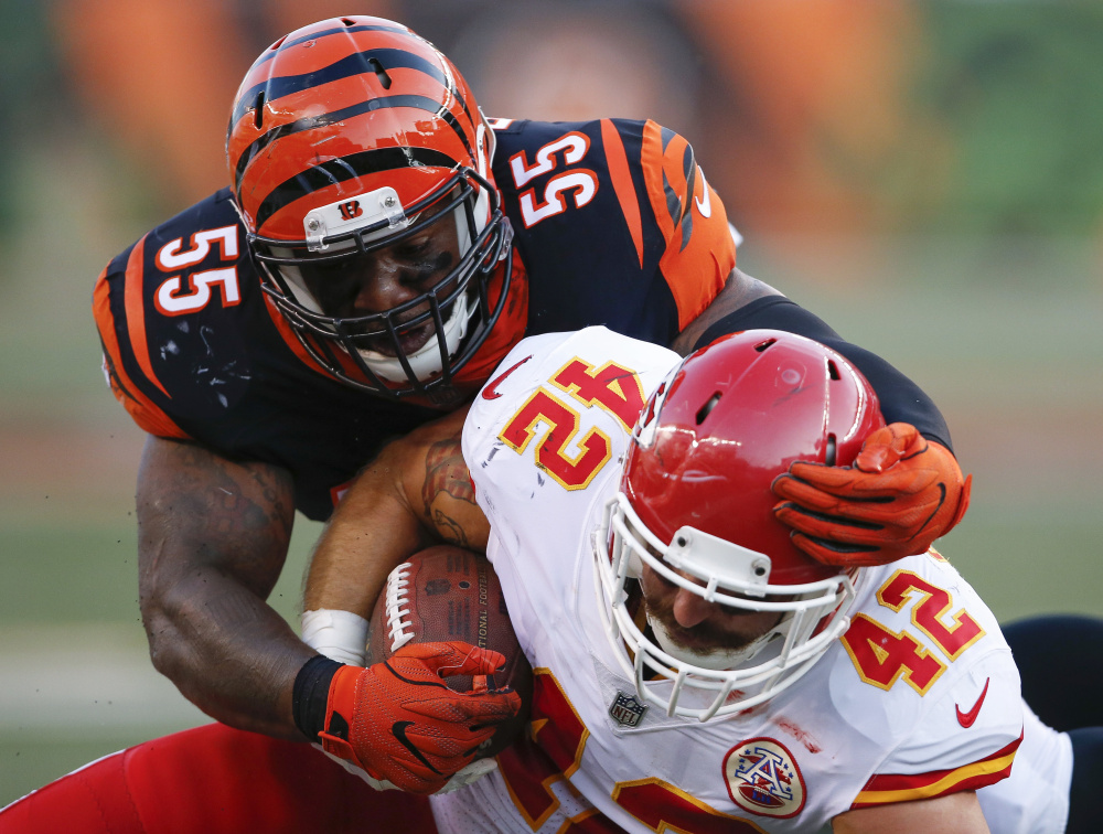 Bengals linebacker Vontaze Burfict tackles Chiefs fullback Anthony Sherman during a game earlier in the preseason. Burfict, who has a history of illegal hits, was suspended five games for a hit on Sherman in the same game.