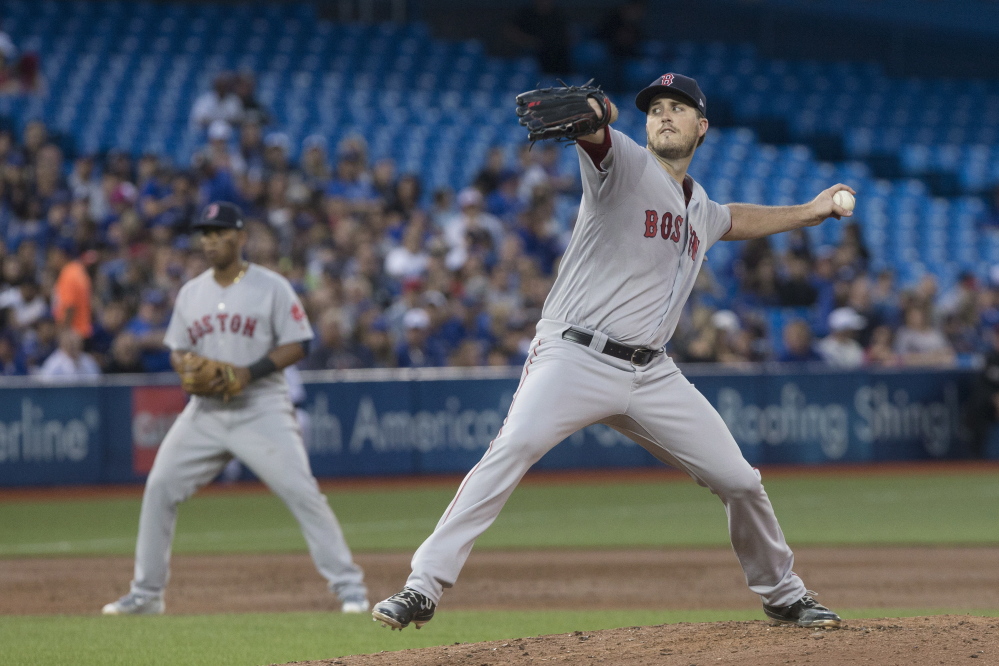 Red Sox starter Drew Pomeranz works against the Blue Jays in the second inning Monday night. He went six innings and improved his record to 14-4.