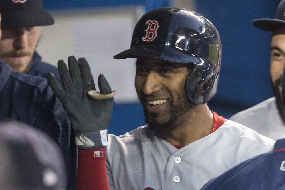 Red Sox second baseman Eduardo Nunez celebrates in the dugout after hitting a solo home run in the third inning.