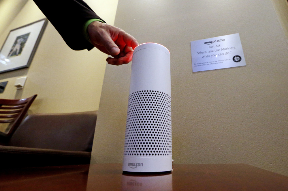 An Amazon Alexa device is switched on for a demonstration of its use in a ballpark suite before a Seattle Mariners baseball game in Seattle. Microsoft and Amazon are making their Alexa and Cortana voice assistants team up and talk to each other in new collaboration.