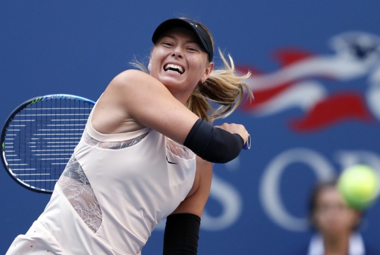 Maria Sharapova became the first player to reach the third round of this year's U.S. Open when she rallied Wednesday for a 6-7 (4), 6-4, 6-1 win over Timea Babo.