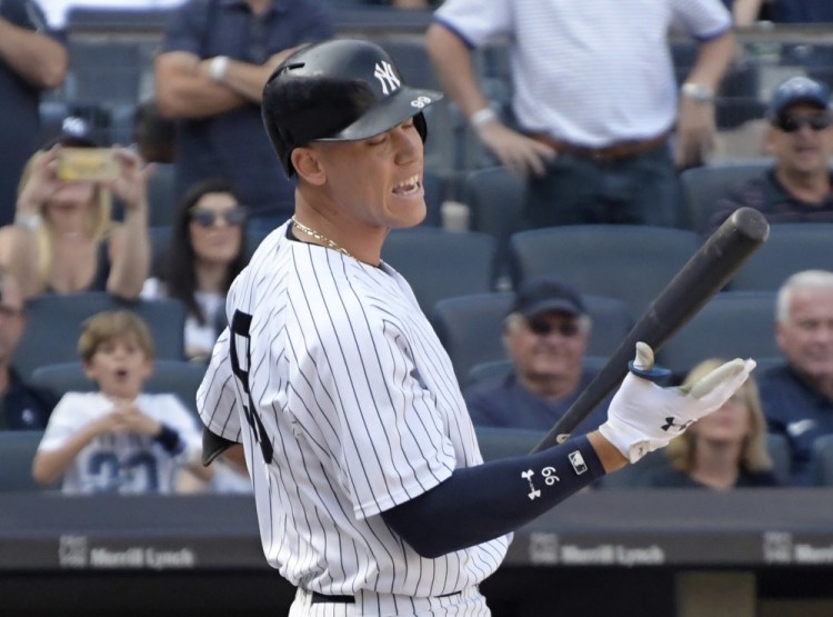 Pinch hitter Aaron Judge reacts after striking out in the ninth inning of the Yankees' 2-1 loss to Cleveland in the first game of a doubleheader Wednesday in New York.
