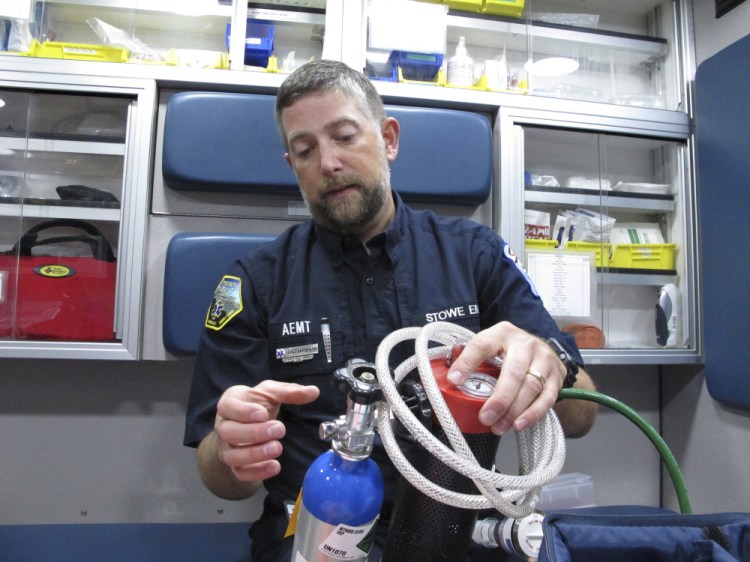 Scott Brinkman, chief of Stowe Department of Emergency Medical Services, demonstrates how nitrous oxide is used in an ambulance, in Stowe, Vt. Several rural ambulance crews are using nitrous oxide, or laughing gas, to treat patients' pain en route to the hospital when paramedics aren't on board to provide narcotics.