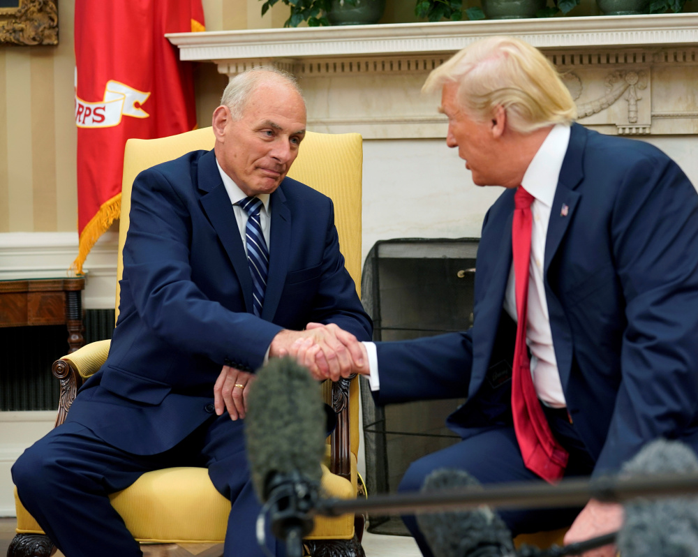 President Trump with John Kelly in July. While Kelly's restructuring of who has access to the president is welcomed by senior administration officials, Trump himself often resists the rigid structure that makes it appear he's being managed. "Donald Trump resists being handled," a former adviser says.