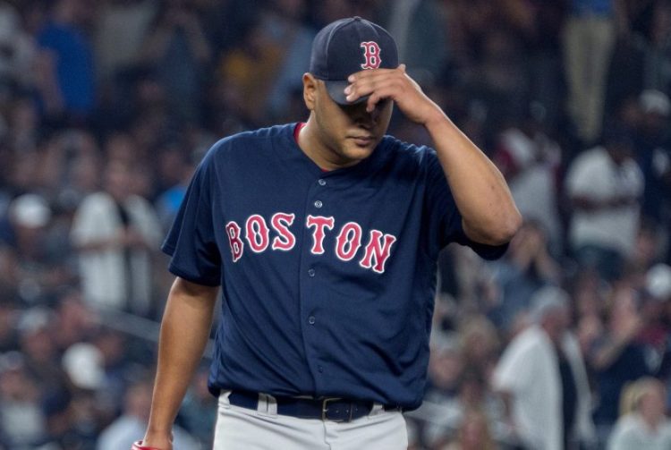 Boston starter Eduardo Rodriguez walks back to the mound between Yankees batters in the sixth inning Thursday night in New York.