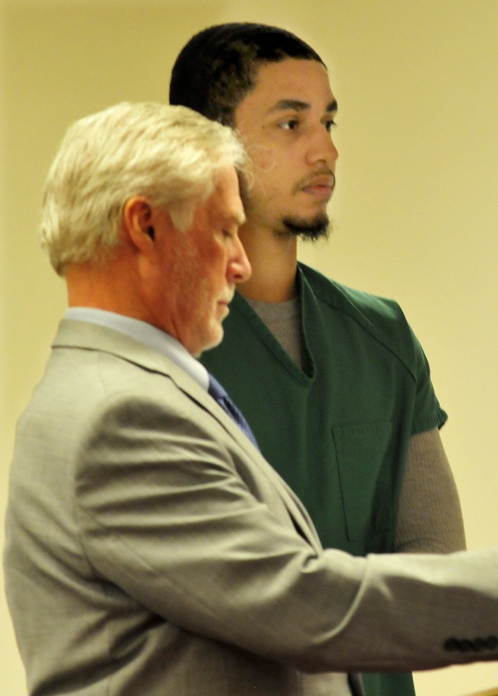 Defendent Dreaquan Foster, right, attends an arraignment hearing on charges related to a Sidney home invasion last spring at the Capital Judicial Center in Augusta on Thursday. At left is his attorney, Thomas Tilton.