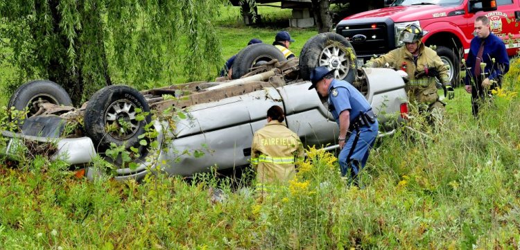 State police and Fairfield firefighters arrive at the crash off Albion Road in Benton on Tuesday.