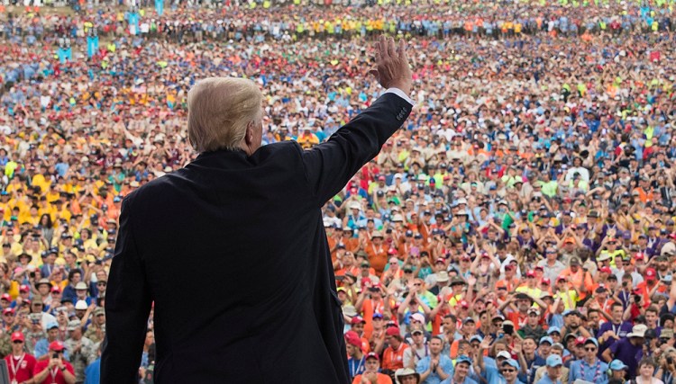 President Donald Trump waves to the crowd after speaking at the 2017 National Scout Jamboree in Glen Jean, W.Va.,on July 24, 2017.